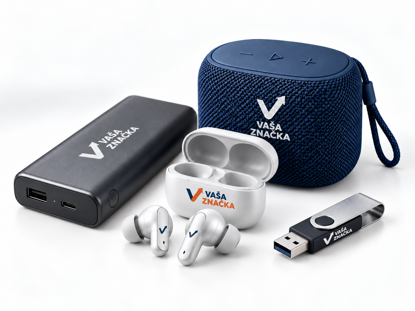Powerbanka, modrý reproduktor, biele slúchadlá a USB kľúč